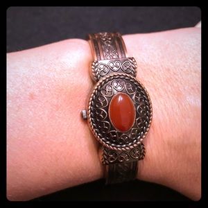 Elegant Bronze Women's Watch with Red Accent